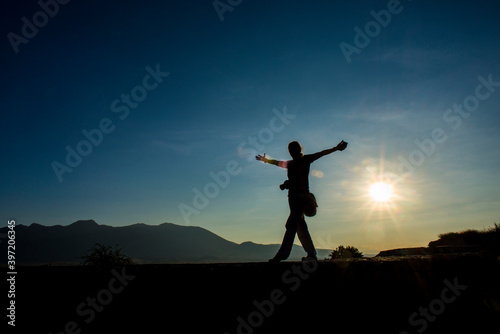 silhouette of a person in the sunset