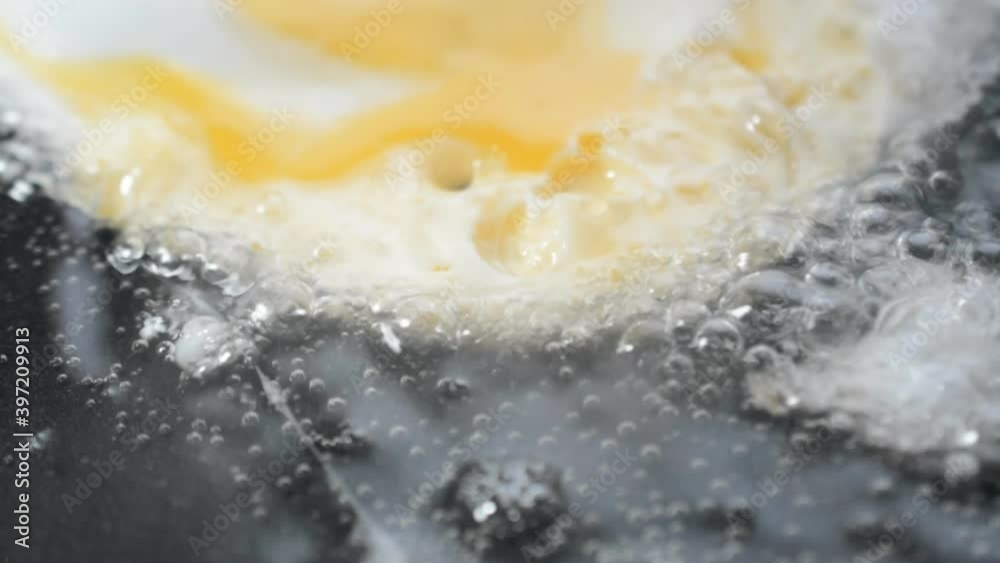 chicken eggs into a frying pan close up chicken eggs into a frying pan close up
