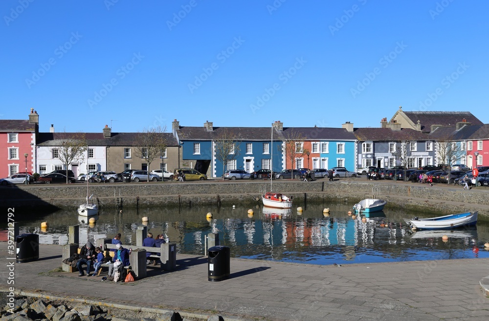 Colourful houses and buildings beside the pretty harbour at  Aberaeron, Ceredigion, Wales, UK.