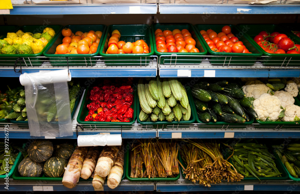 Various vegetables on shelves in grocery store
