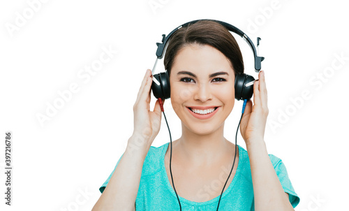 Hearing test, hearing diagnostic. Smiling Hispanic woman wearing headphones having an audiometry test, isolated in white