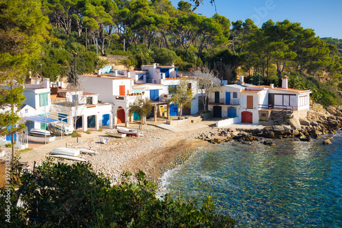 Panoramic view of the picturesque fishing village of Cala S'Alger, from the coastal path of La Fosca to the Castell beach, Costa Brava, Catalonia, Spain