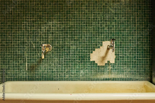 Green tile sink interior in bathroom