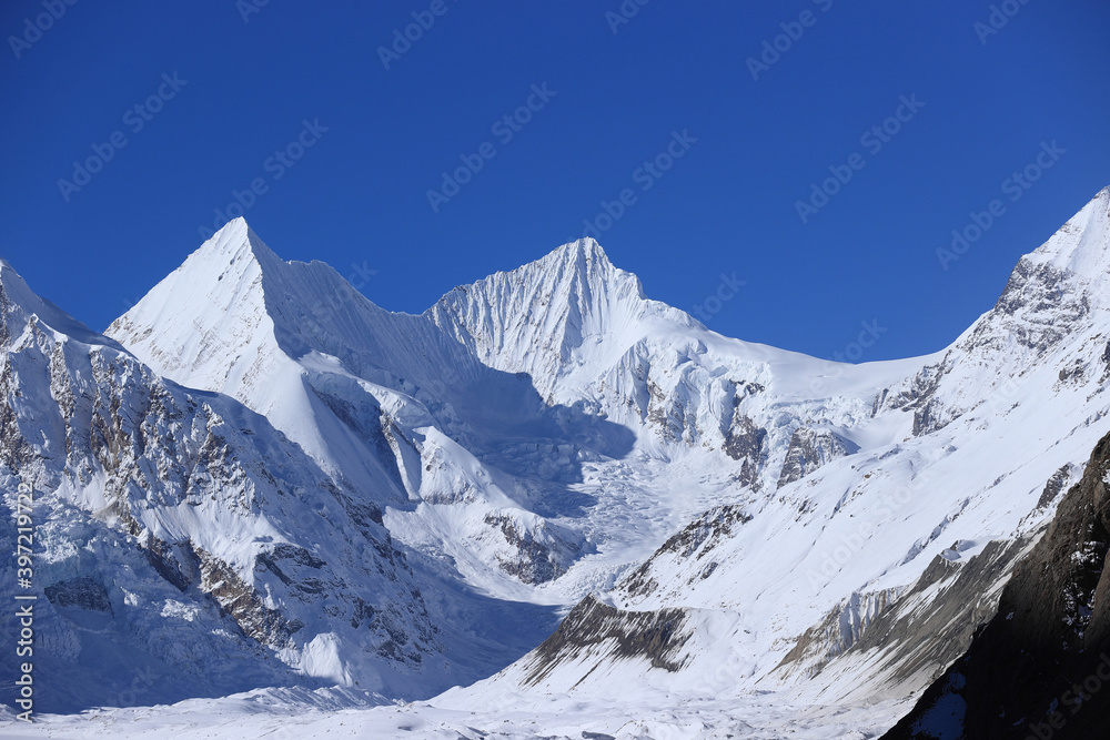 Snow mountains under blue sky in tibet,China