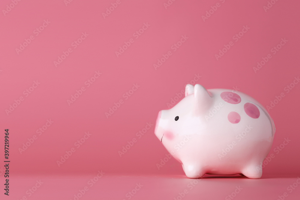 Pink piggy bank on isolated and pink background studio, meaning of saving or earning money or business investment for advertising concept.