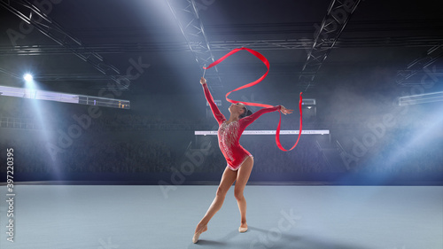 Rhythmic gymnast in professional arena. © VIAR PRO studio