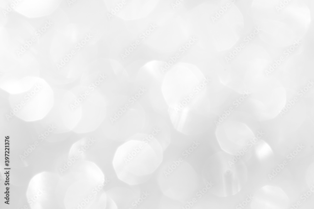 White sparkles with blurry circles texture, soft bokeh for a beautiful new year screensaver. Template for decoration of a holiday postcard, web design. White sparkles with blurry circles texture, soft bokeh for a beautiful new year screensaver. Template for decoration of a holiday postcard, web design.