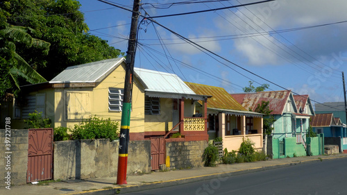 Basseterre, St Kitts and Nevis - December 2019: Typical local colorful wooden houses in one of the neighborhoods photo