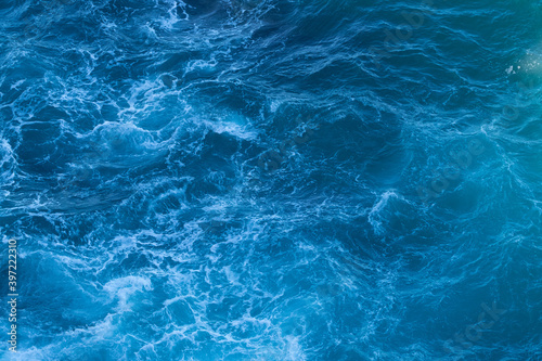 Wild and power of the ocean, foamy water, waves. © David Pastyka