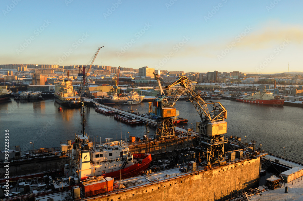 Port in Murmansk. Beautiful aerial air winter vibrant view of Murmansk, Russia, a port city and the administrative center of Murmansk Oblast, Kola peninsula, Kola Bay, shot from quadrocopter drone