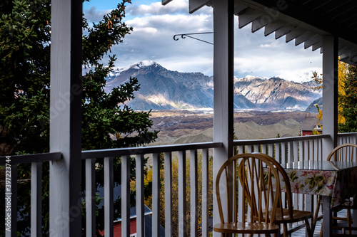 View from the porch of the Lodge, chair and tables and Kennicott valley view with mountains, Kennicott, Alaska.