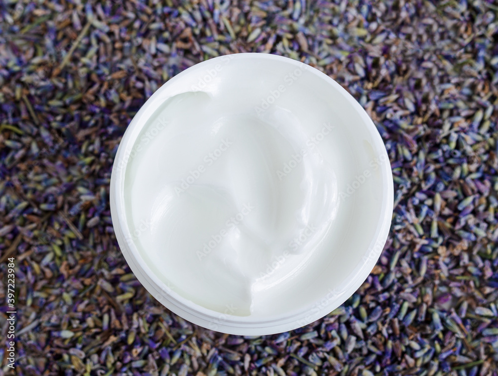 White facial mask (face cream, shea butter, hair mask, body butter) in the small white container. Natural skin and hair concept. Top view, copy space. - obrazy, fototapety, plakaty 