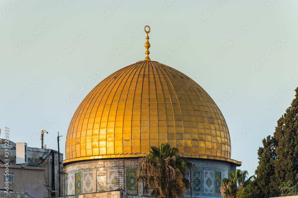 Close-up of Golden Dome of the Rock, Qubbat al-Sakhrah, under sunset on Temple Mount of Old City of Jerusalem,  Israel. One of the oldest extant works of Islamic architecture