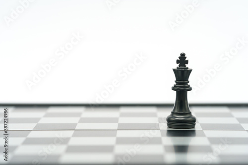 King Chess is placed on a chessboard.using as background business concept and Strategy concept with copy space for your text or design.