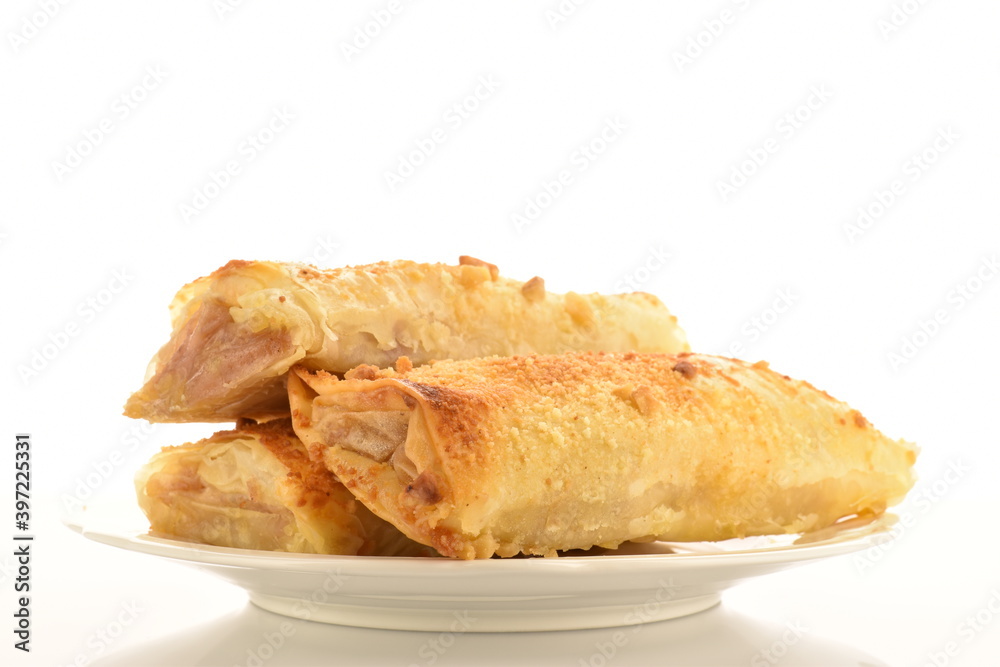 Homemade apple mini strudel, close-up isolated on white. Homemade apple mini strudel, close-up isolated on white.
