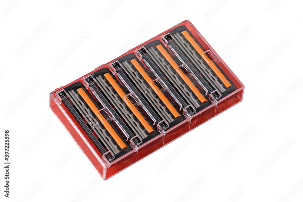 Cassette with replaceable shaving blades on a white background close-up Cassette with replaceable shaving blades on a white background close-up