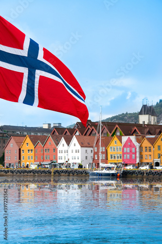Bergen in Norway. View of historical colorful buildings in Bryggen. Colorful historic houses situated in the harbor. Mountains in the background. UNESCO World Heritage Site
