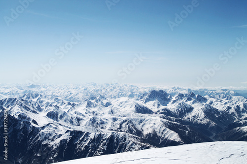 snow covered mountains from the top of Kazbegi © Gabriel