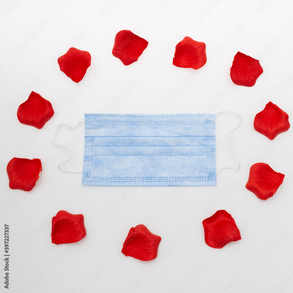 Surgical face mask and red heart shape. covid-19 concept Surgical face mask and red heart shape. covid-19 concept