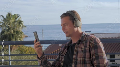 Video chat conference on phone, middle aged remote worker on video call during lockdown, office from hotel, freelancer using application. High quality 4k footage
