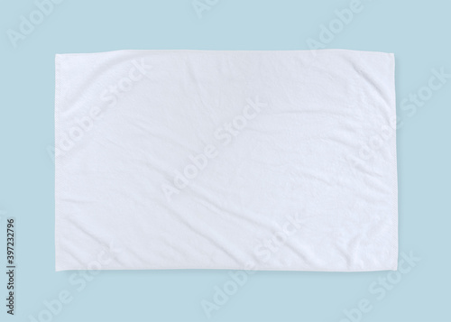 White towel mock up template cotton fabric cloth wiper mockup isolated on blue background with clipping path, flat lay top view