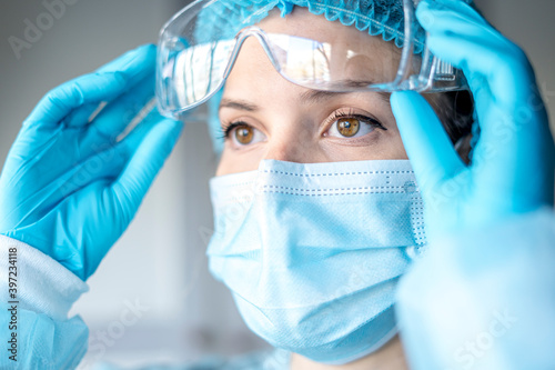 Medical Surgical Doctor and Health Care, Portrait of Surgeon Doctor in PPE Equipment on Isolated Background. Medicine Female Doctors Wearing Face Mask and Cap for Patients Surgery Work. Medic Hospital