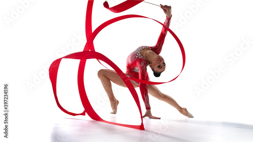 Rhythmic gymnast isoladed on white. photo