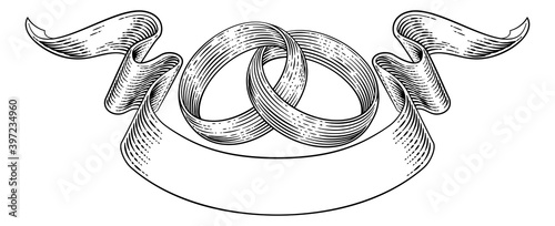 Wedding rings or bands intertwined in a vintage woodcut retro style wedding or engagement invite design