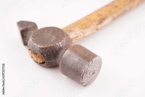 old hammer with wooden handle on white background