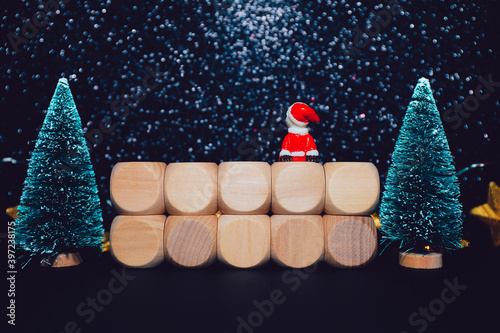 Christmas composition with little Santa Claus looking at night sky