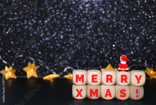 Little Santa Claus looking at the night sky full of shining stars