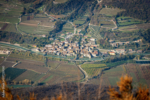 Aerial view of Adige Valley, Vallagarina, from the Mountain peak of Corno d'Aquilio with the small village of Belluno Veronese, Veneto, Italy, Europe.