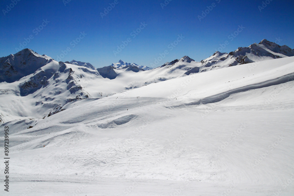 Skiers on the Azau glacier on the slope of Mount Elbrus, Elbrus region