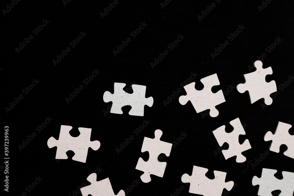 Naklejka premium puzzle on a black background