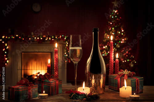 close up view of champagne with gifts on  color back photo