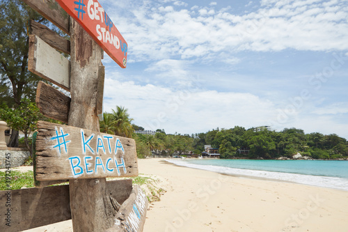 View of wooden signpost on summer tropic beach 