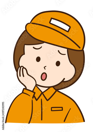 困っている作業着の女性
