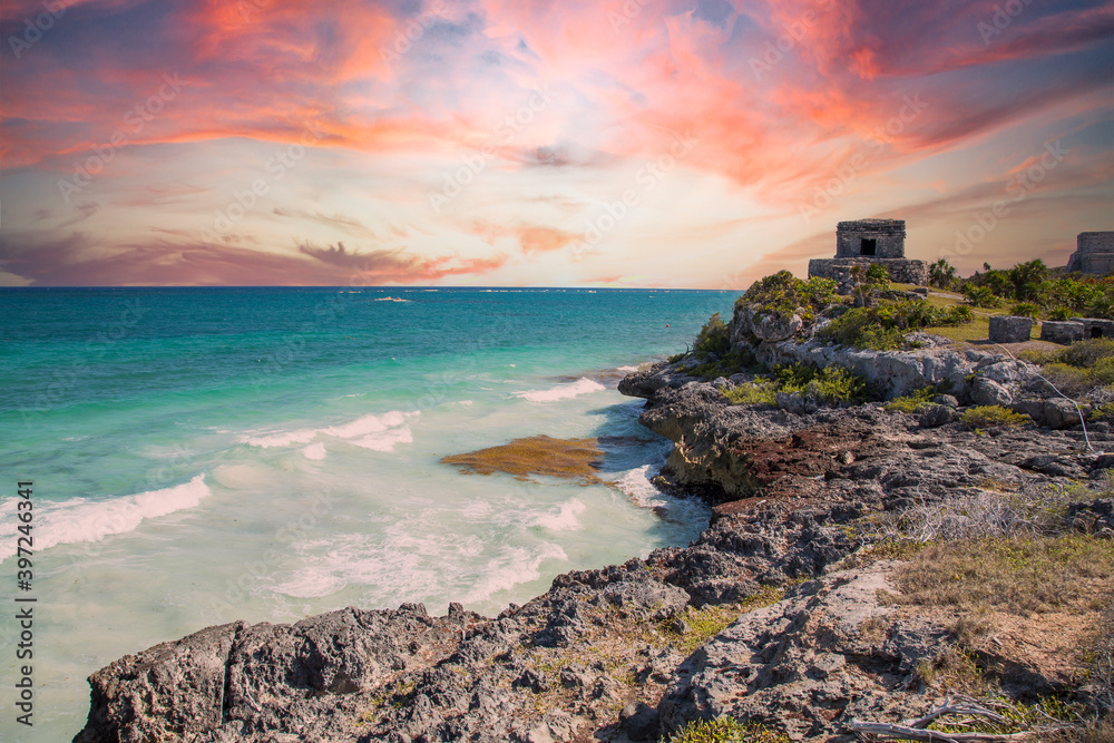 Sunset at the sea next to the Mayan temples of Tulum in Mexico Sunset at the sea next to the Mayan temples of Tulum in Mexico