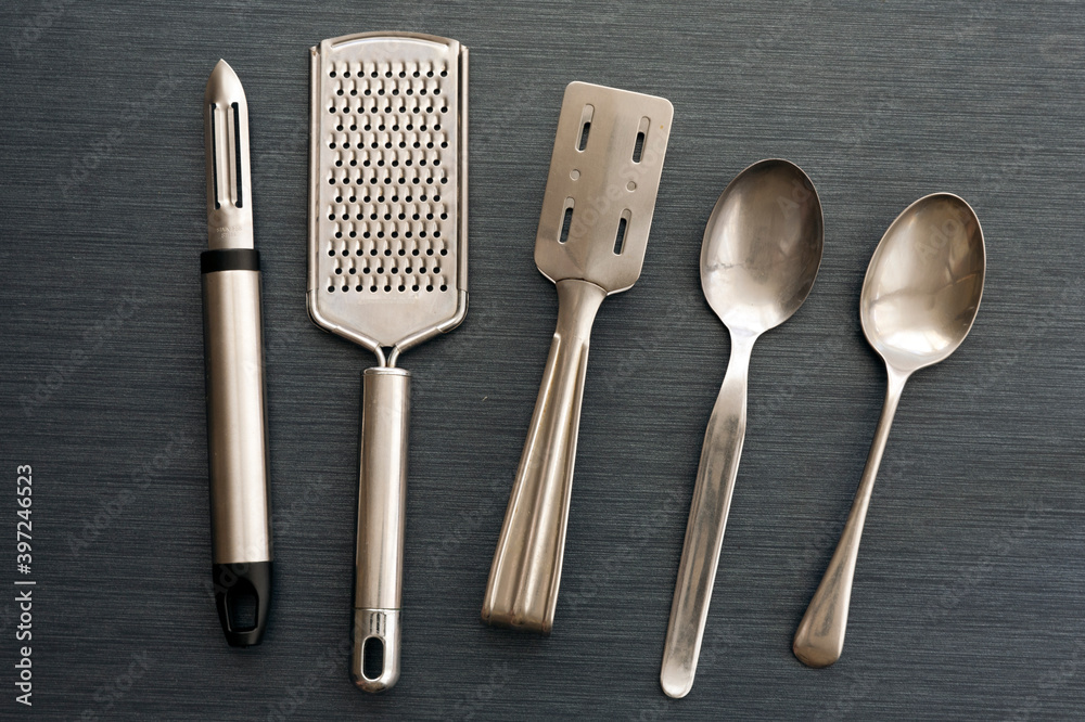 A kitchen utensil is a small hand held tool used for food preparation.  Common kitchen tasks. Other cutlery such as forks and spoons are both  kitchen and eating utensils. Stock Photo