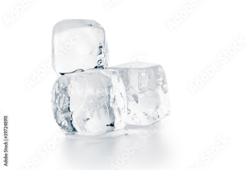 Natural ice cubes on white surface. Purity and refreshment concept.