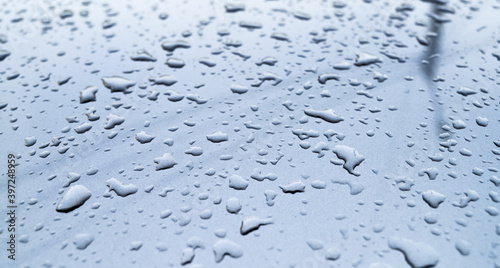 Water drops on metal surface. Macro with shallow depth of field.