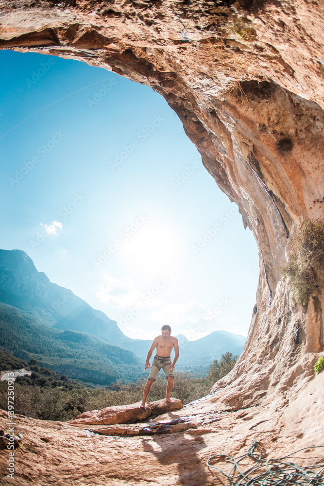 A man is preparing to climb a rock.