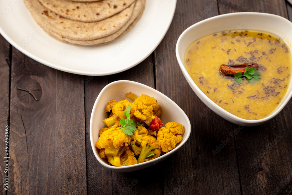 traditional indian meal lentil soup, flat bread and cauliflower vegetable, dal, roti and sabzi traditional indian meal lentil soup, flat bread and cauliflower vegetable, dal, roti and sabzi