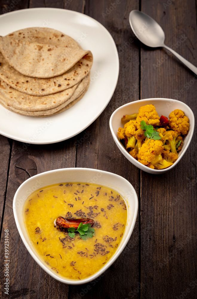 traditional indian meal lentil soup, flat bread and cauliflower vegetable, dal, roti and sabzi traditional indian meal lentil soup, flat bread and cauliflower vegetable, dal, roti and sabzi