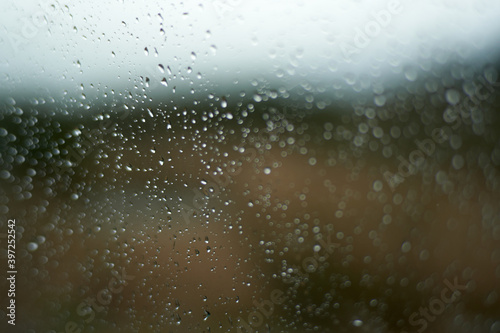 light rain falls on the glass
