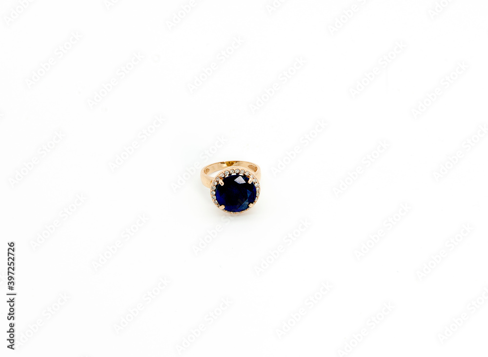 gold ring with a stone on a white background gold ring with a stone on a white background