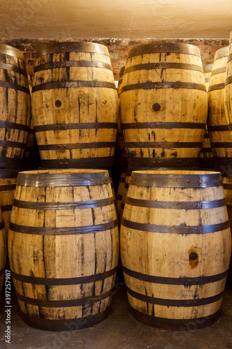 Old whisky barrels, stacked in a warehouse ready to fill with raw spirit and leave to mature over many years