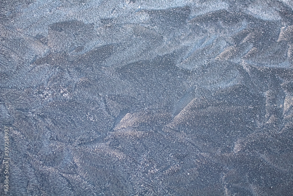 Snow and blue texture pattern close-up in cold tones Snow and blue texture pattern close-up in cold tones