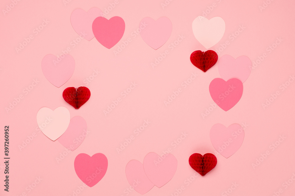 Pink, red, golden paper hearts on pastel pink background. Valentines day concept. Flat lay, top view, copy space.