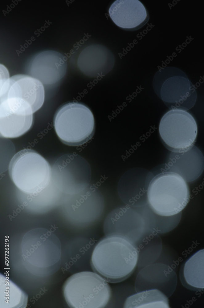 Abstract pattern of bokeh garland lights on a dark background Abstract pattern of bokeh garland lights on a dark background